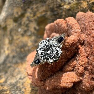 Elegant Vintage Diamond and Sapphire Engagement Ring with Intricate Detailing